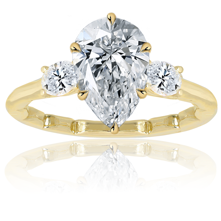 Three Stone Ring With Center Pear