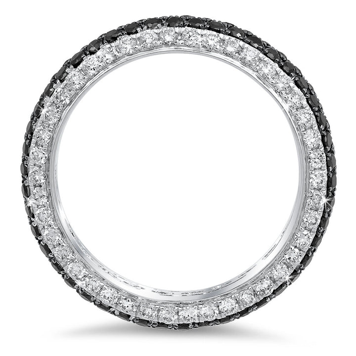 Black and white diamonds sparkle on a 18K gold band