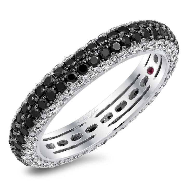 Black and white diamonds sparkle on a 18K gold band