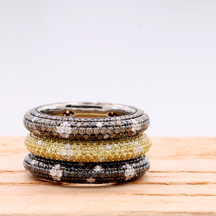 Sapphires and diamonds in 18K yellow gold form a stunning eternity band